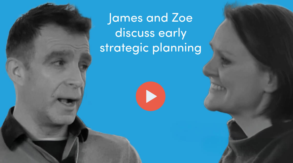Blue background with two people mid-conversation with a coral circle in the middle containing a white 'play' arrow. Above the people is white text that reads 'James and Zoe discuss early strategic planning'