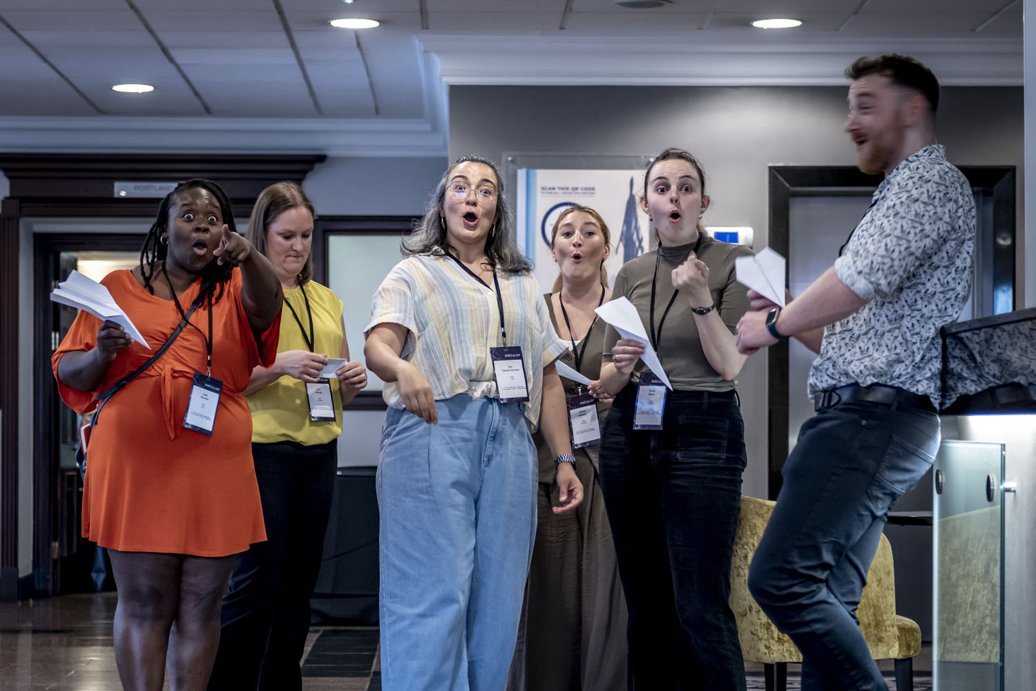Amiculum team members celebrating a game during the company's summer event