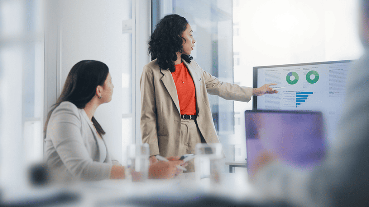 Two people with one presenting data to the other